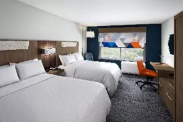 Holiday Inn Express Room - Standard Double Queen room is 319 square feet and features mini-fridge, microwave, Keurig coffee maker, black out shades and plenty of space to spread out and relax in. Photo