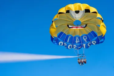 Parasailing / Watersports - Guests soar high above the crystal-clear waters of Siesta Key beneath our iconic Minion parasail chute. Parasailing is one of the most unforgettable ways to experience t... Photo