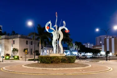 "Bravo" by Jorge Blanco - Steel and aluminum sculpture of three abstracted figures with raised "arms." The three abstract figures of BRAVO! express the cultural energy of the City of Sarasota and r... Photo