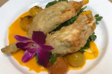 Artichokes Esther - crispy artichoke hearts, tomato, lemon, caper butter, aged Parmesan Photo