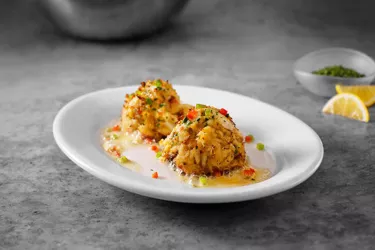 Sizzling Blue Crab Cakes - Served with lemon butter on a sizzling plate. Photo 2