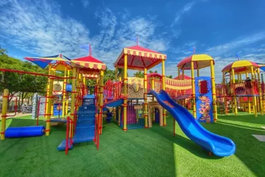 Circus Playground - This playground is circus inspired! Featuring a small splash area, rock climbing, slides, music makers, swings, and so much more. Perfect for picnics and spending the day with y... Photo