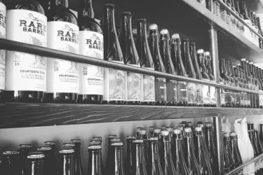 99 Bottles Taproom & Bottle Shop - shelves full of a well-curated selection of exceptional craft beer... Photo