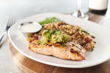 AVOCADO SALMON - Fresh cold water Chilean salmon, avocado salad, citrus crema, snow peas, Mediterranean farro Photo