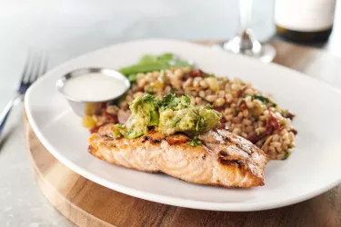 AVOCADO SALMON - Fresh cold water Chilean salmon, avocado salad, citrus crema, snow peas, Mediterranean farro Photo