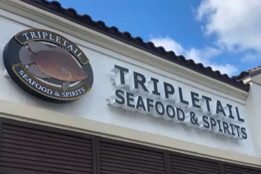 Tripletail Seafood & Spirits - Tripletail Seafood & Spirits is conveniently located in The Landings, with plenty of parking. Dine in with us or enjoy our private, air conditioned patio and waterfall. Photo
